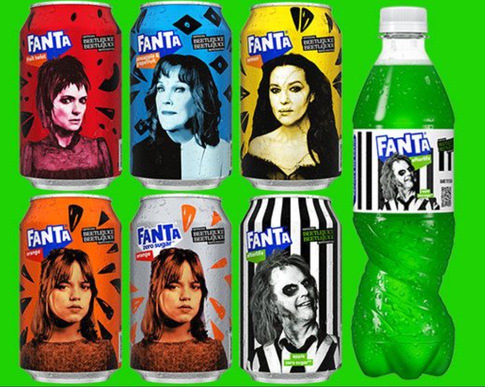 The full 2024 Beetlejuice Fanta set — Fruit Twist, Pineapple and Blueberry, Lemon, Orange, Orange Zero Sugar, the striped Afterlife can, and the Afterlife bottle